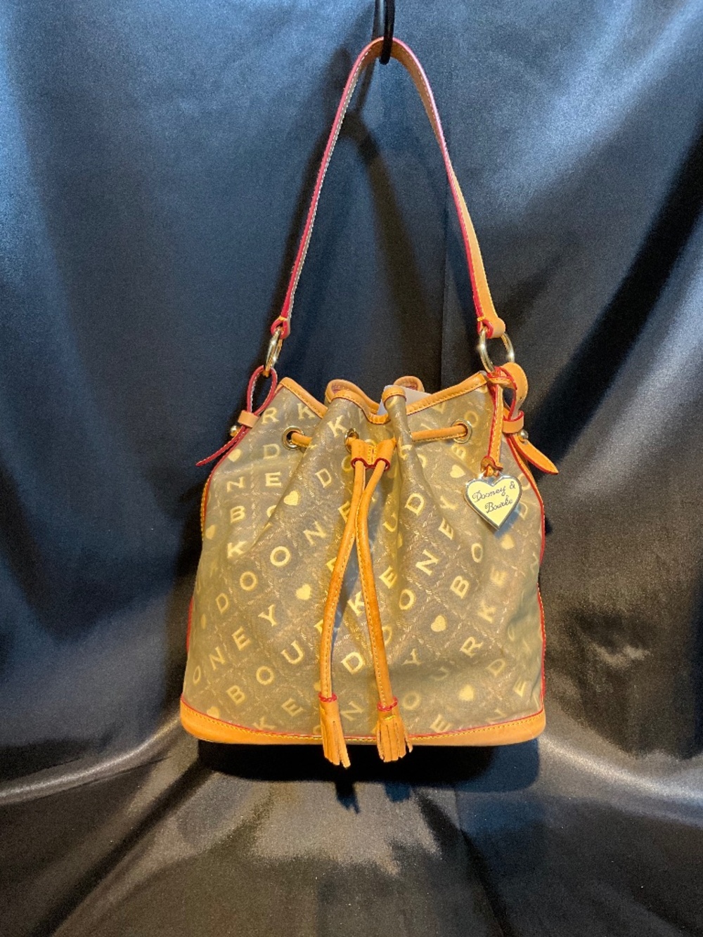 Dooney & Bourke bucket bag with draw string.     H10E